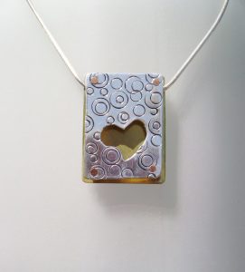 Riveted Cut Out Pendant